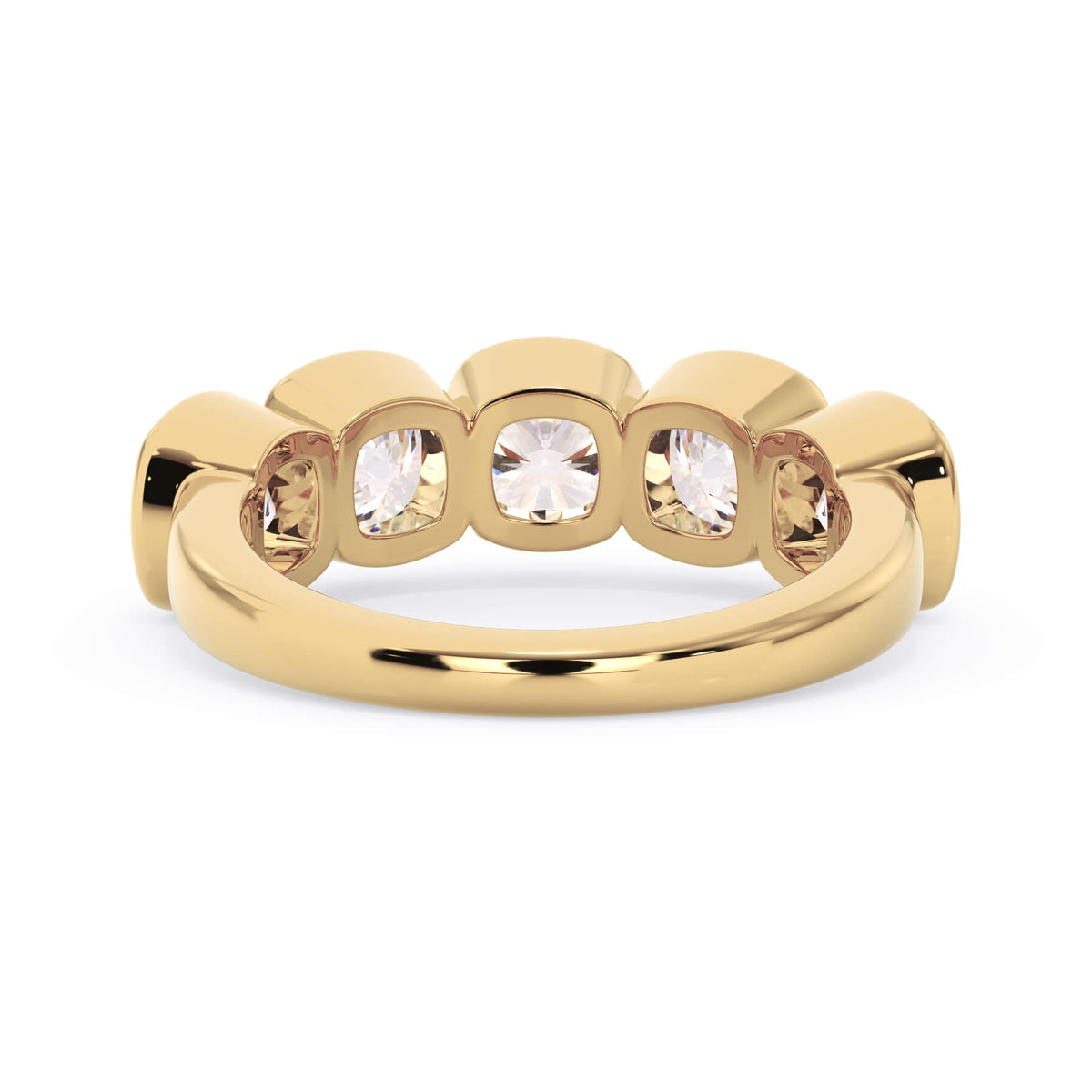 A picture of a five stone diamond wedding ring with cushion shape diamonds that are bezel set in yellow gold on a white background with a view of the underside of the ring.