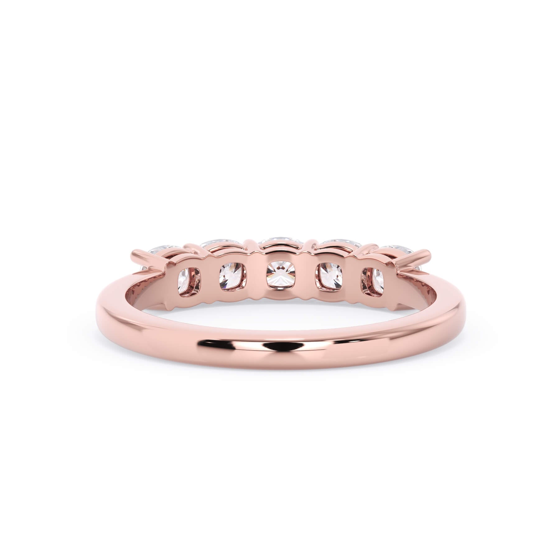 A picture of a five stone diamond wedding ring with cushion shape diamonds that are shared prong set in rose gold on a white background with a view of the underside of the ring.
