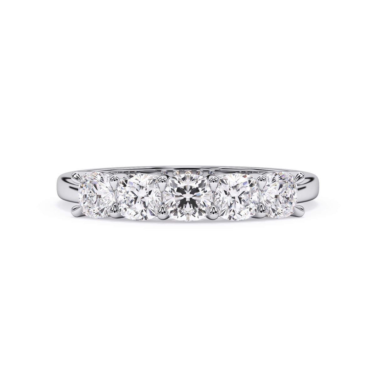 A picture of a five stone diamond wedding ring with cushion shape diamonds that are shared prong set in white gold or platinum on a white background with the ring facing forward, lying down.