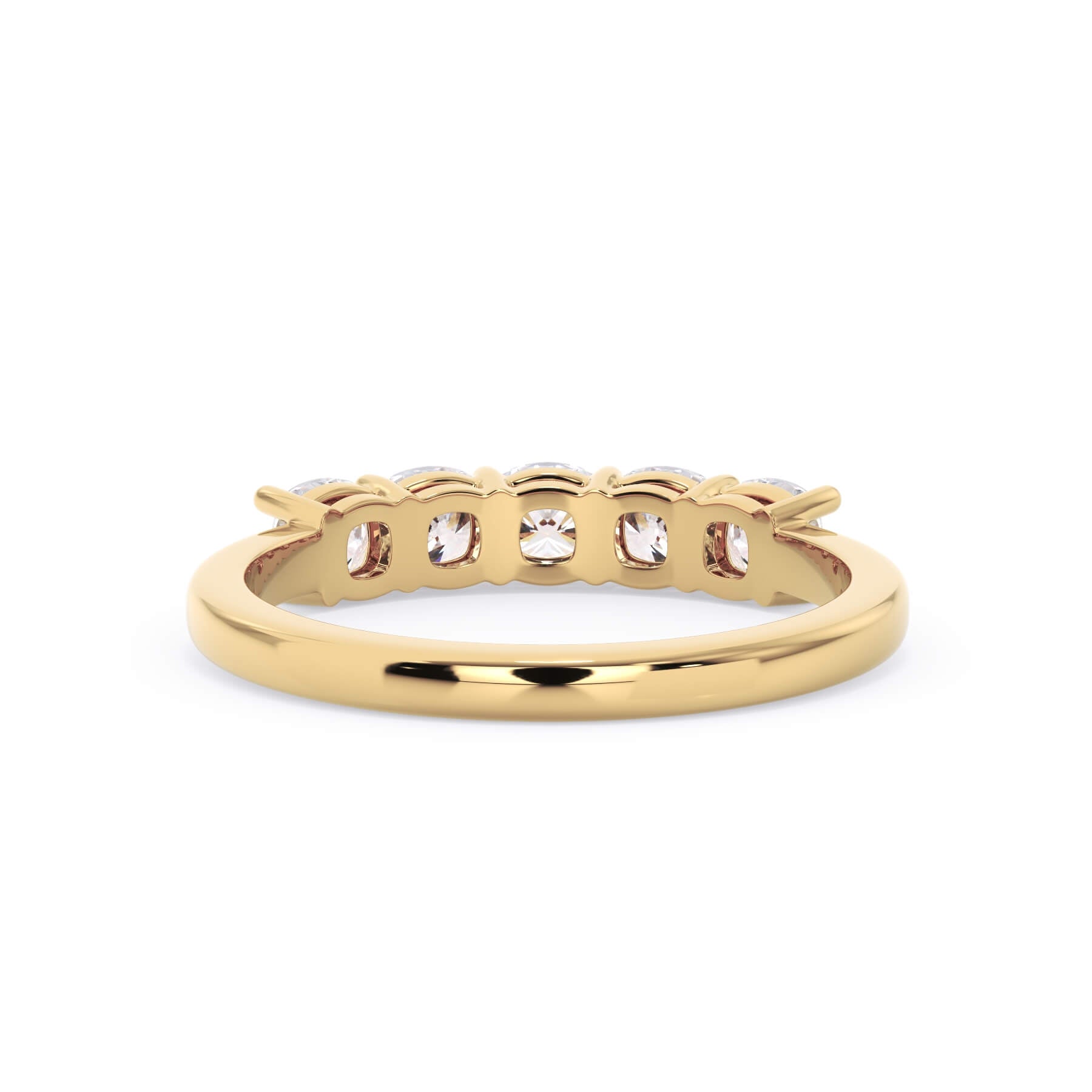 A picture of a five stone diamond wedding ring with cushion shape diamonds that are shared prong set in yellow gold on a white background with a view of the underside of the ring.