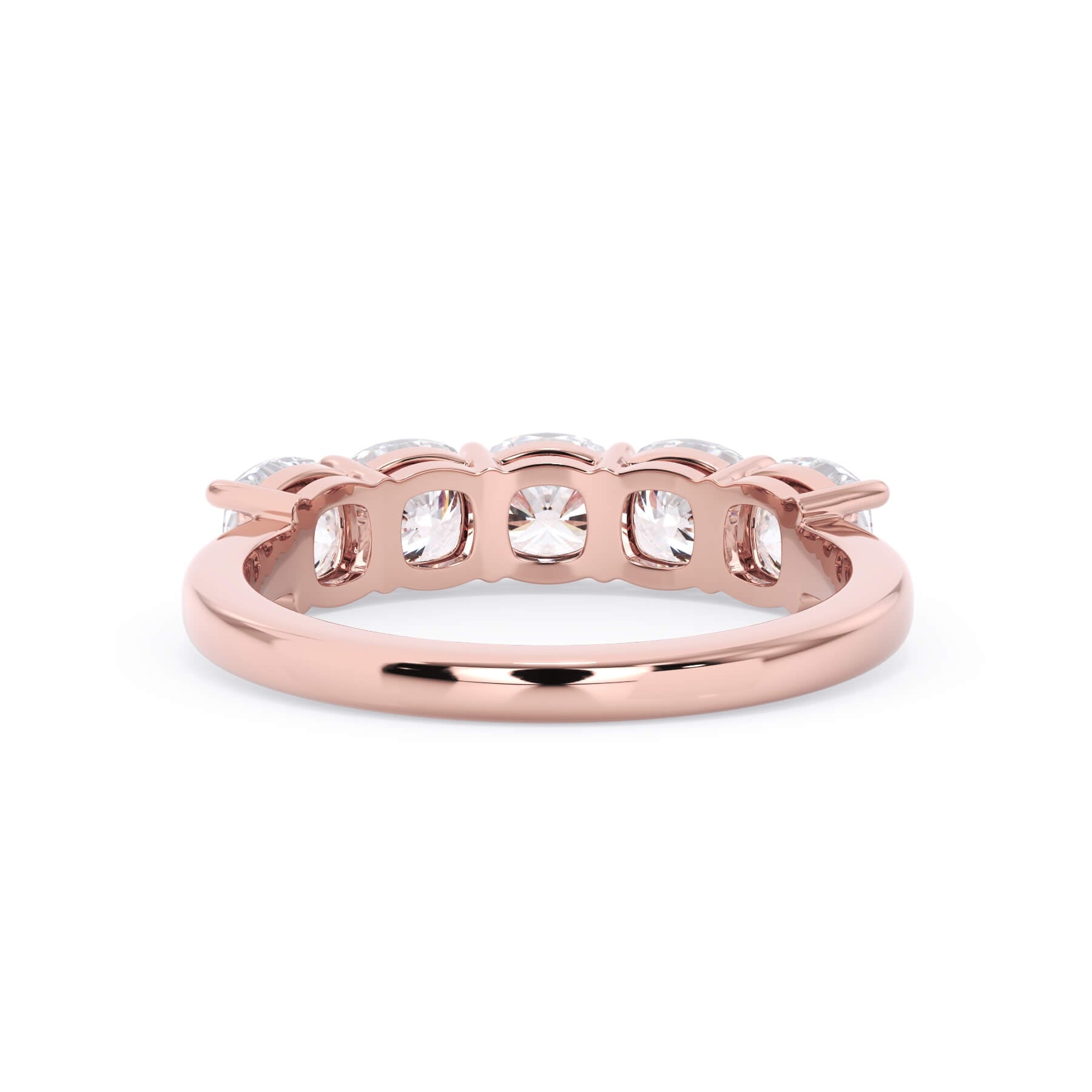 A picture of a five stone diamond wedding ring with cushion shape diamonds that are shared prong set in rose gold on a white background with a view of the underside of the ring.