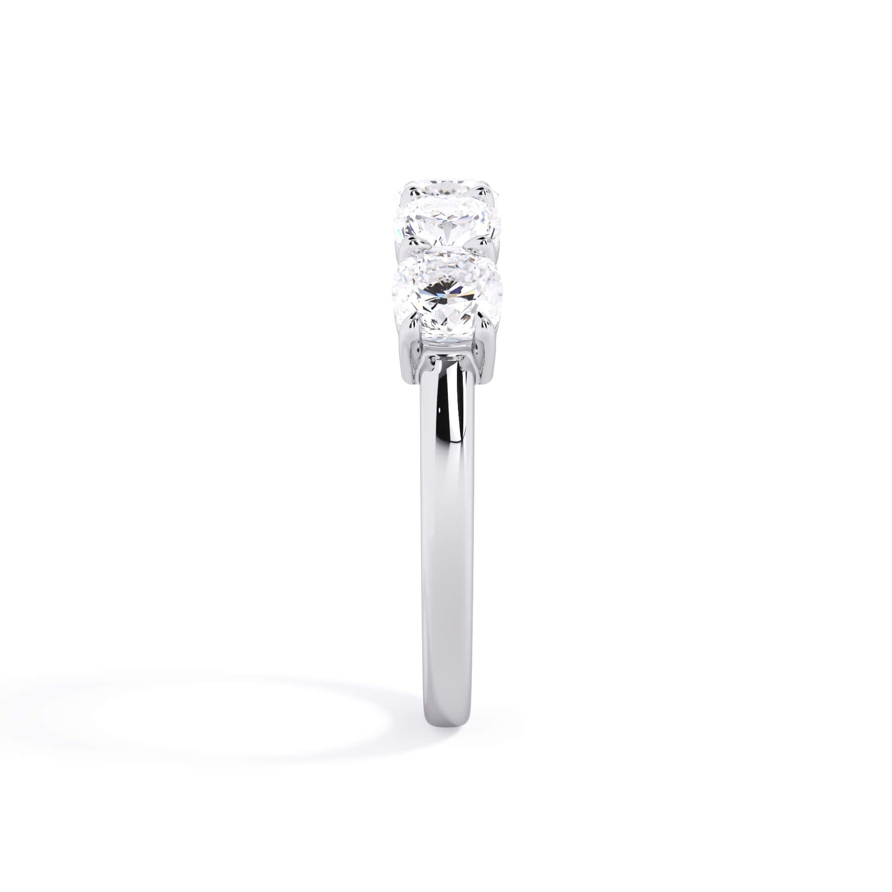 A picture of a five stone diamond wedding ring with cushion shape diamonds that are shared prong set in white gold or platinum on a white background with a side profile view.
