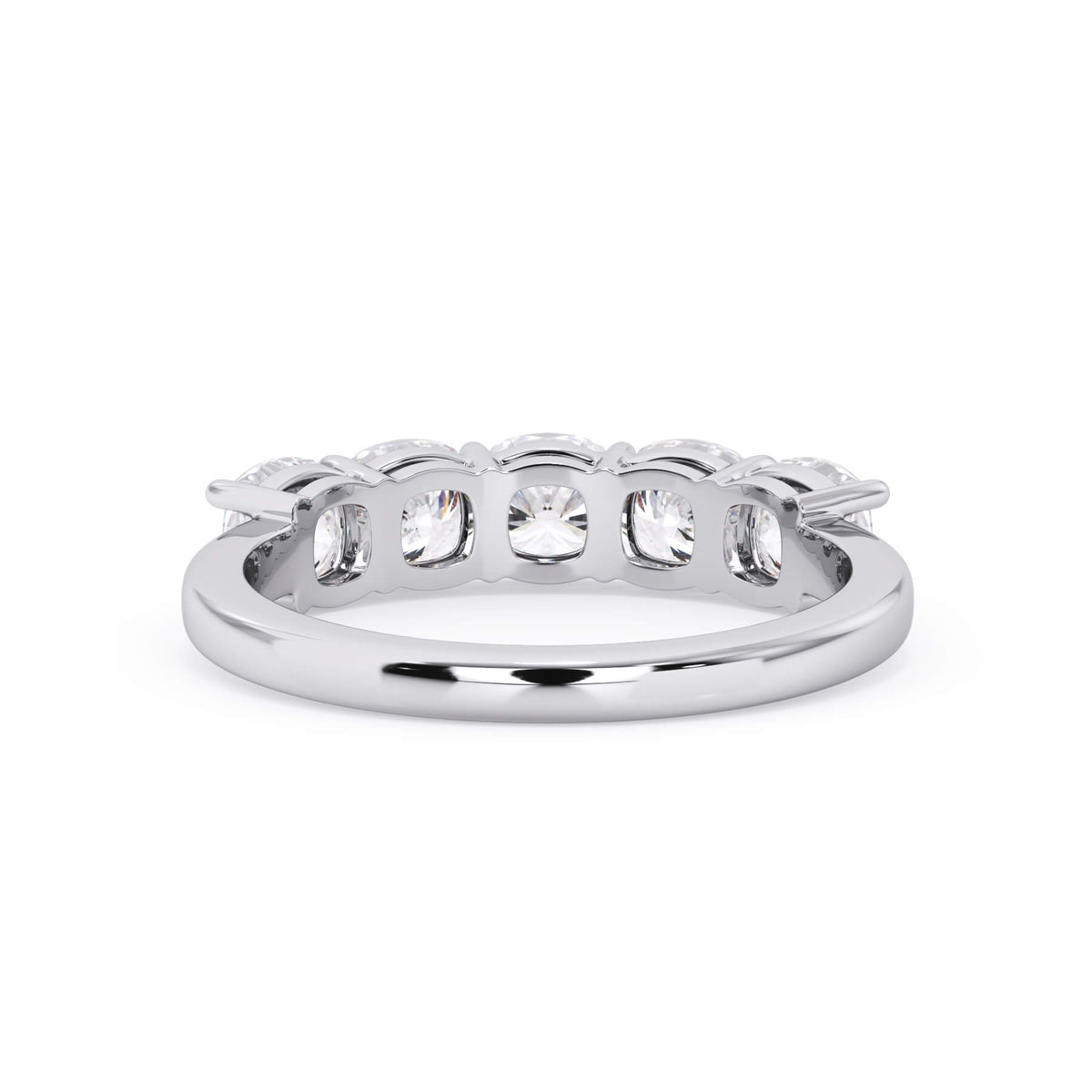 A picture of a five stone diamond wedding ring with cushion shape diamonds that are shared prong set in white gold or platinum on a white background with a view of the underside of the ring.