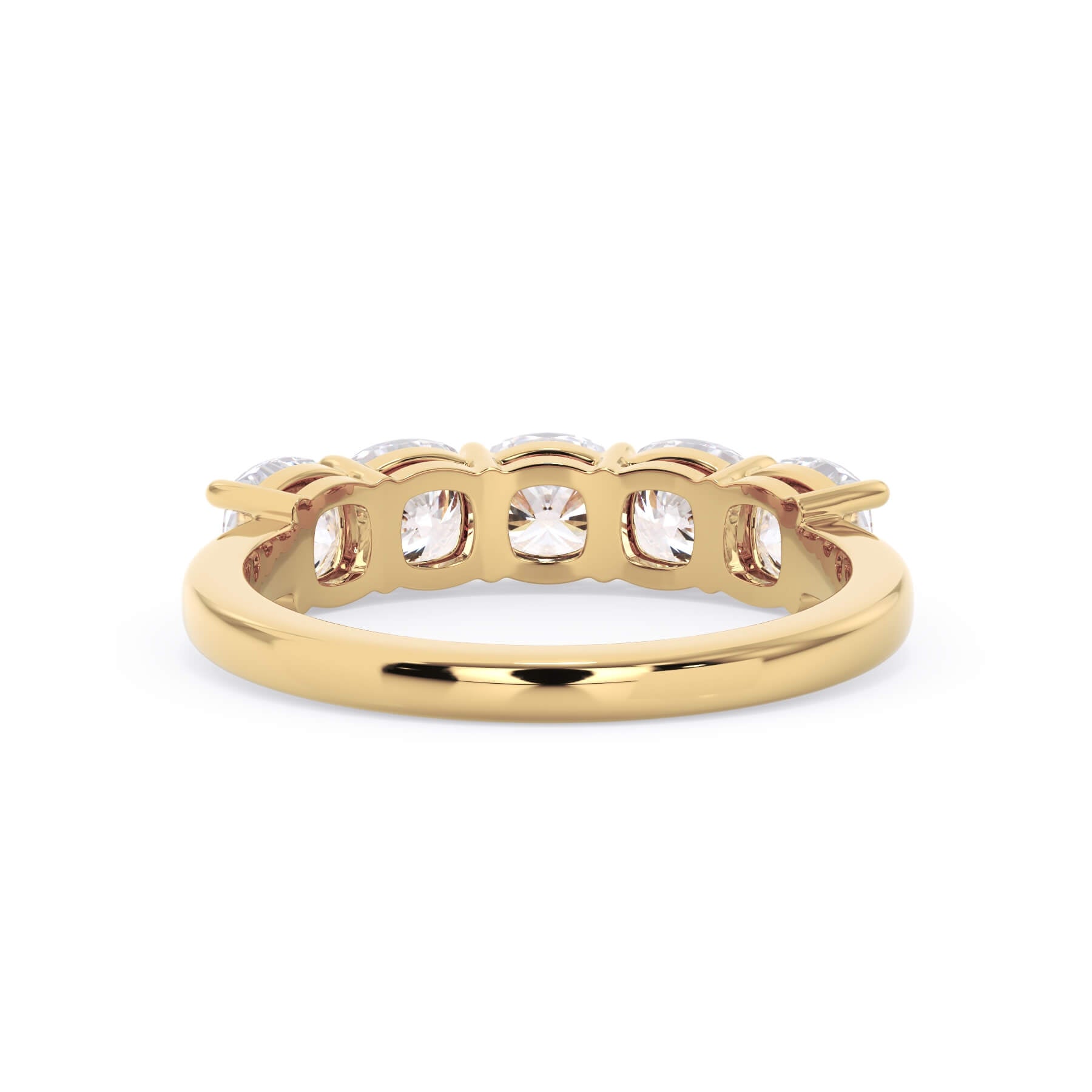 A picture of a five stone diamond wedding ring with cushion shape diamonds that are shared prong set in yellow gold on a white background with a view of the underside of the ring.