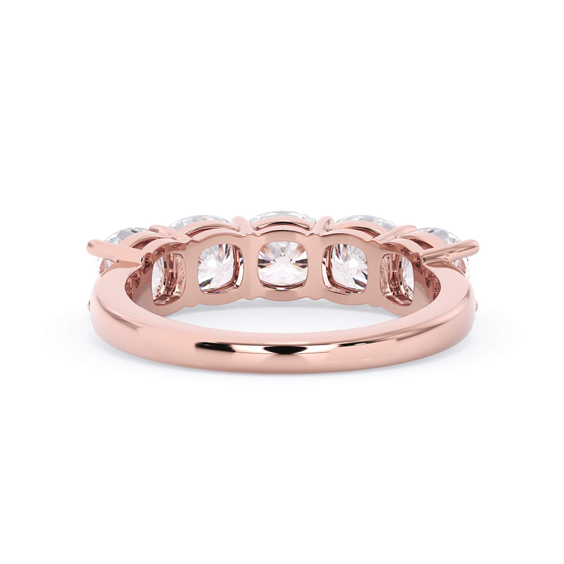 A picture of a five stone diamond wedding ring with cushion shape diamonds that are shared prong set in rose gold on a white background with a view of the underside of the ring.