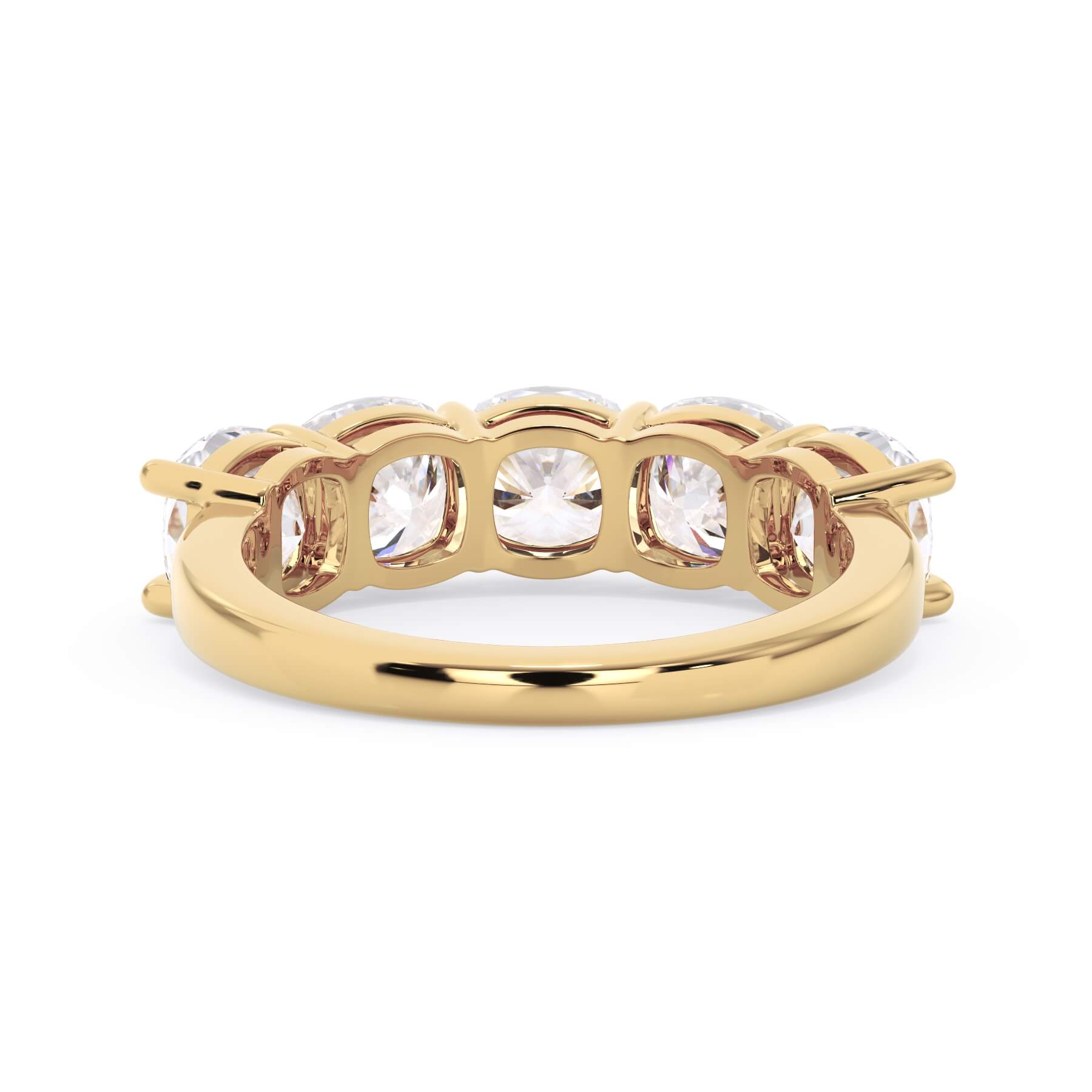 A picture of a five stone diamond wedding ring with cushion shape diamonds that are shared prong set in yellow gold on a white background with a view of the underside of the ring.