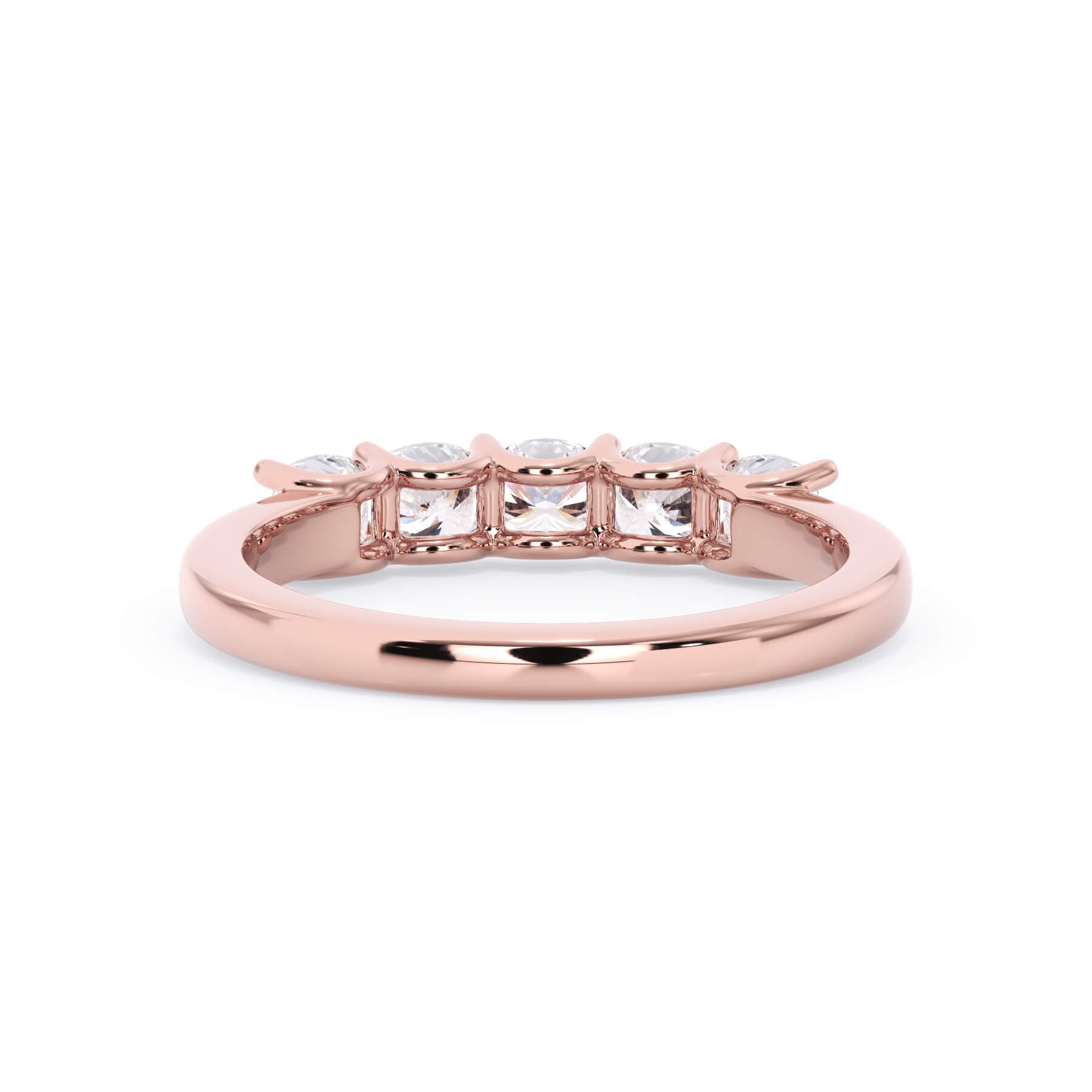 A picture of a five stone diamond wedding ring with cushion shape diamonds that are u prong set in rose gold on a white background with a view of the underside of the ring.