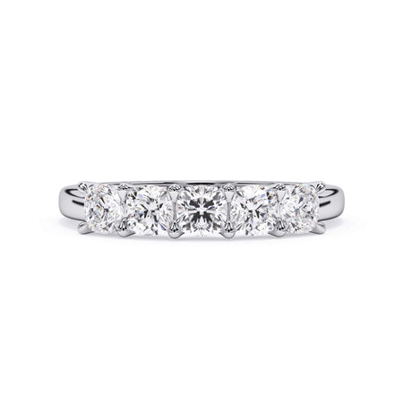 A picture of a five stone diamond wedding ring with cushion shape diamonds that are u prong set in white gold or platinum on a white background with the ring facing forward, lying down.
