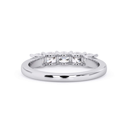 A picture of a five stone diamond wedding ring with cushion shape diamonds that are u prong set in white gold or platinum on a white background with a view of the underside of the ring.