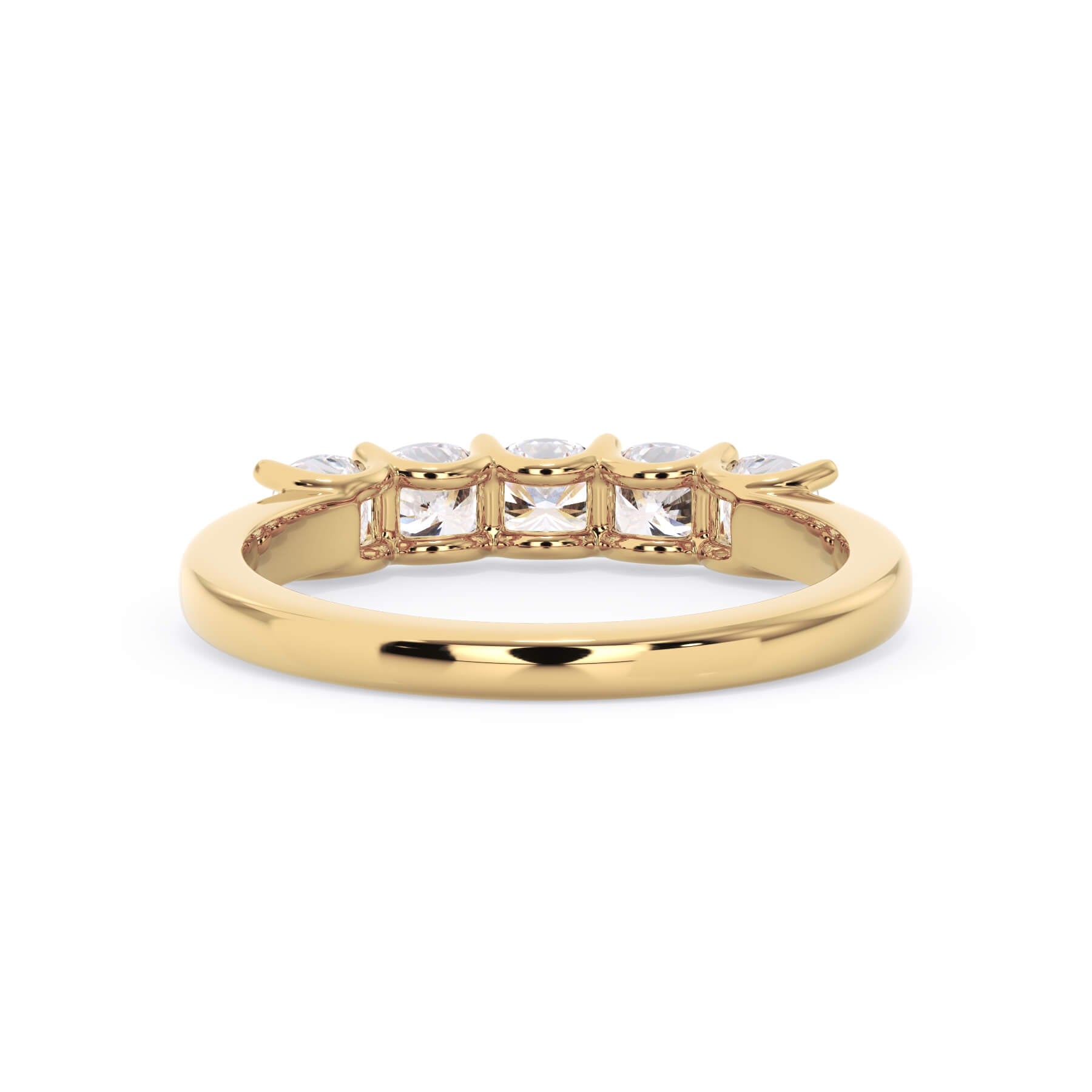 A picture of a five stone diamond wedding ring with cushion shape diamonds that are u prong set in yellow gold on a white background with a view of the underside of the ring.