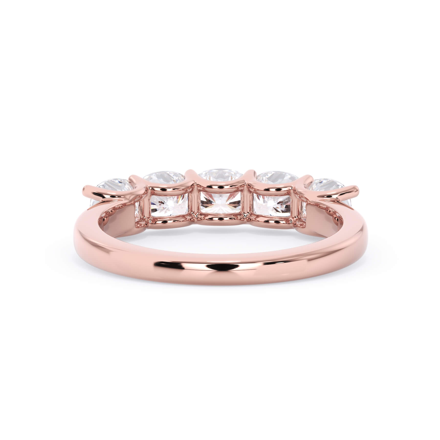 A picture of a five stone diamond wedding ring with cushion shape diamonds that are u prong set in rose gold on a white background with a view of the underside of the ring.