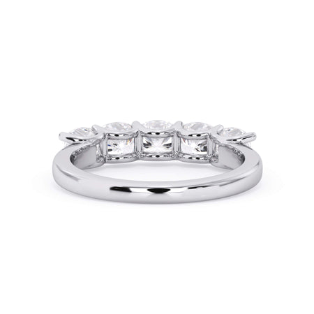 A picture of a five stone diamond wedding ring with cushion shape diamonds that are u prong set in white gold or platinum on a white background with a view of the underside of the ring.