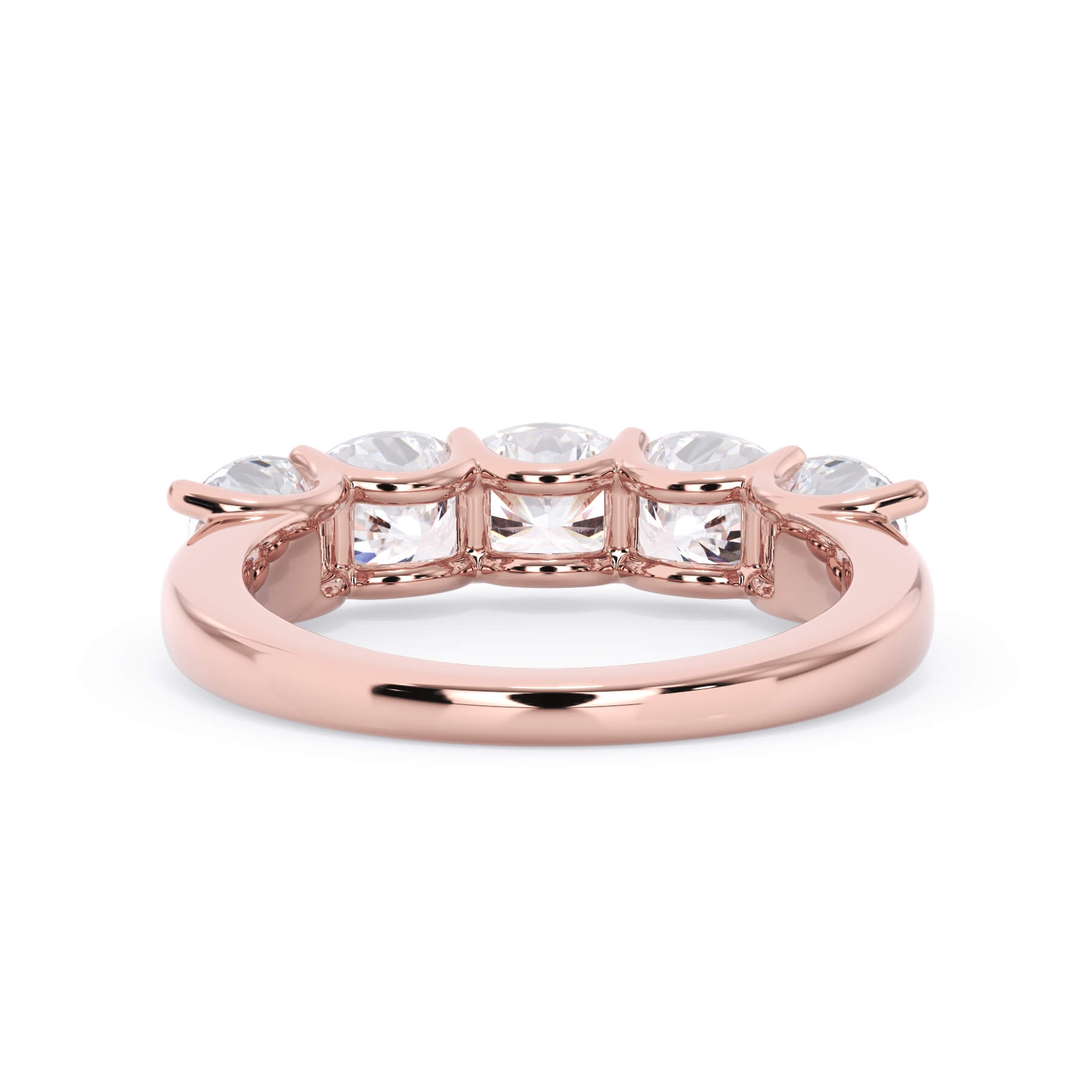 A picture of a five stone diamond wedding ring with cushion shape diamonds that are u prong set in rose gold on a white background with a view of the underside of the ring.