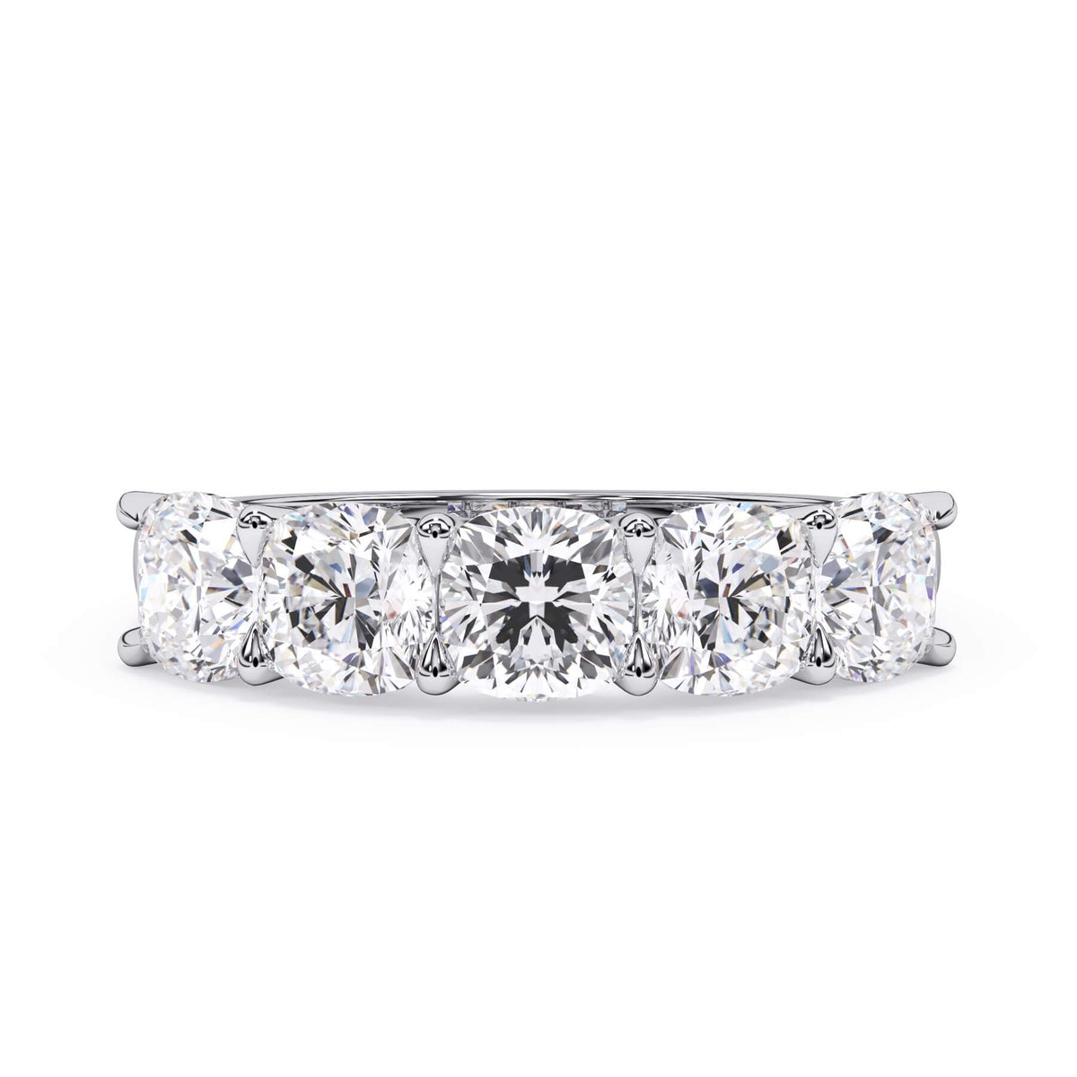 A picture of a five stone diamond wedding ring with cushion shape diamonds that are u prong set in white gold or platinum on a white background with the ring facing forward, lying down.