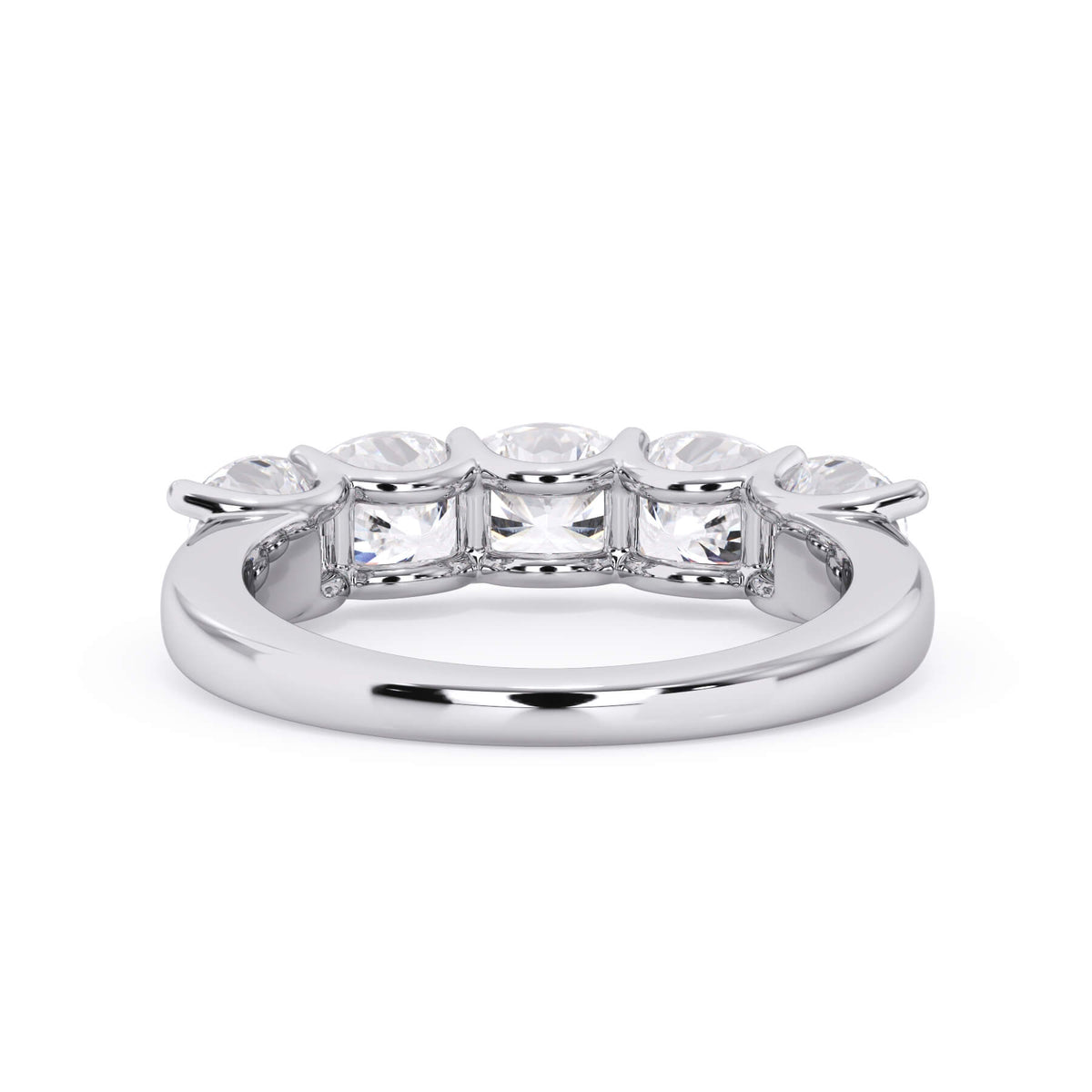 A picture of a five stone diamond wedding ring with cushion shape diamonds that are u prong set in white gold or platinum on a white background with a view of the underside of the ring.