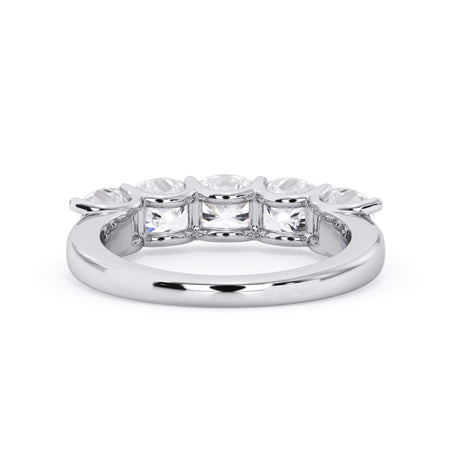A picture of a five stone diamond wedding ring with cushion shape diamonds that are u prong set in white gold or platinum on a white background with a view of the underside of the ring.
