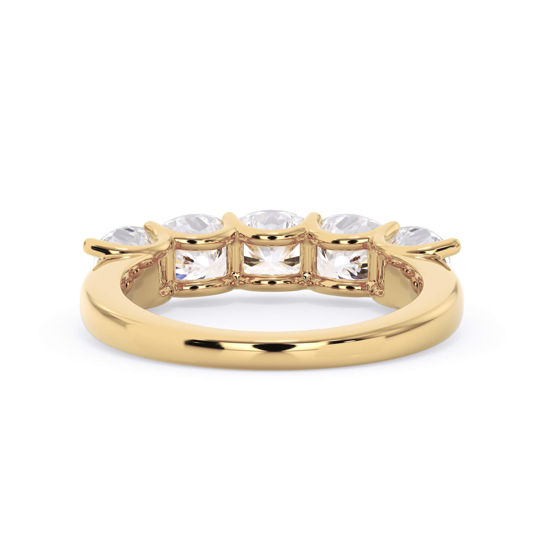 A picture of a five stone diamond wedding ring with cushion shape diamonds that are u prong set in yellow gold on a white background with a view of the underside of the ring.