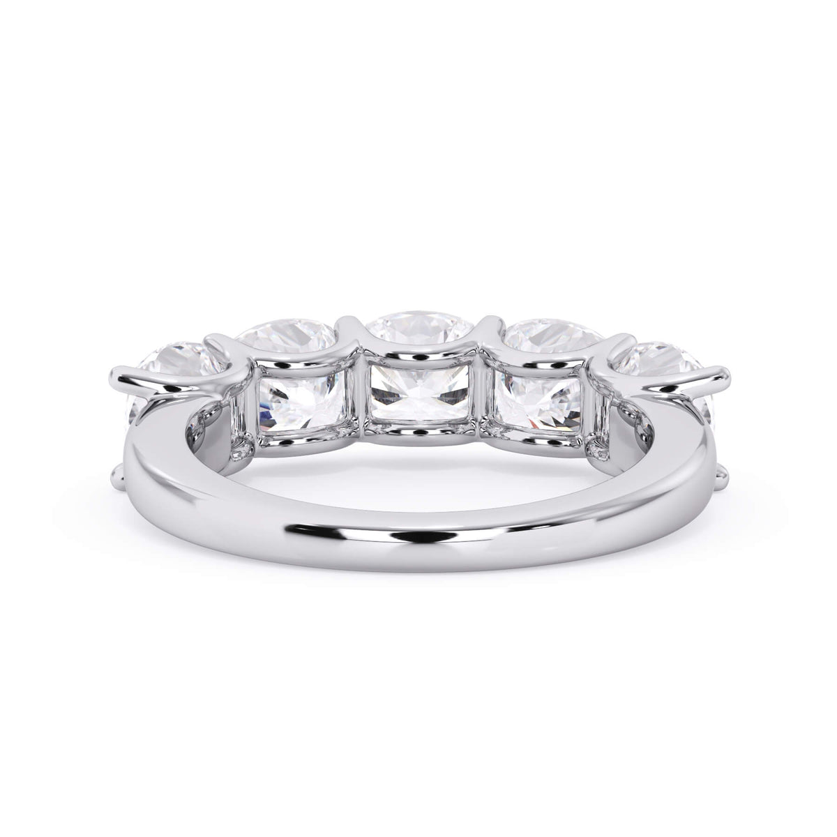 A picture of a five stone diamond wedding ring with cushion shape diamonds that are u prong set in white gold or platinum on a white background with a view of the underside of the ring.