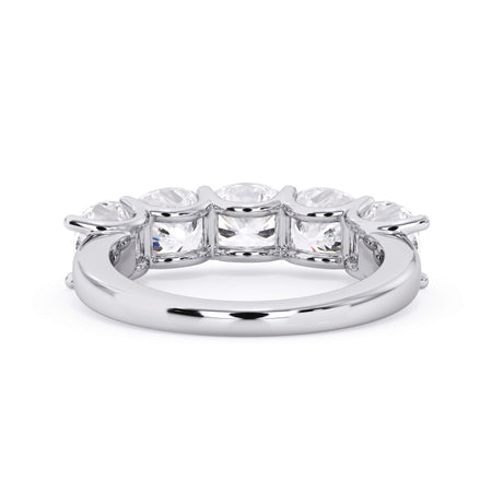 A picture of a five stone diamond wedding ring with cushion shape diamonds that are u prong set in white gold or platinum on a white background with a view of the underside of the ring.