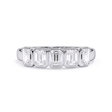 A picture of a five stone diamond wedding ring with emerald cut diamonds that are bezel set in white gold or platinum on a white background with the ring facing forward, lying down.