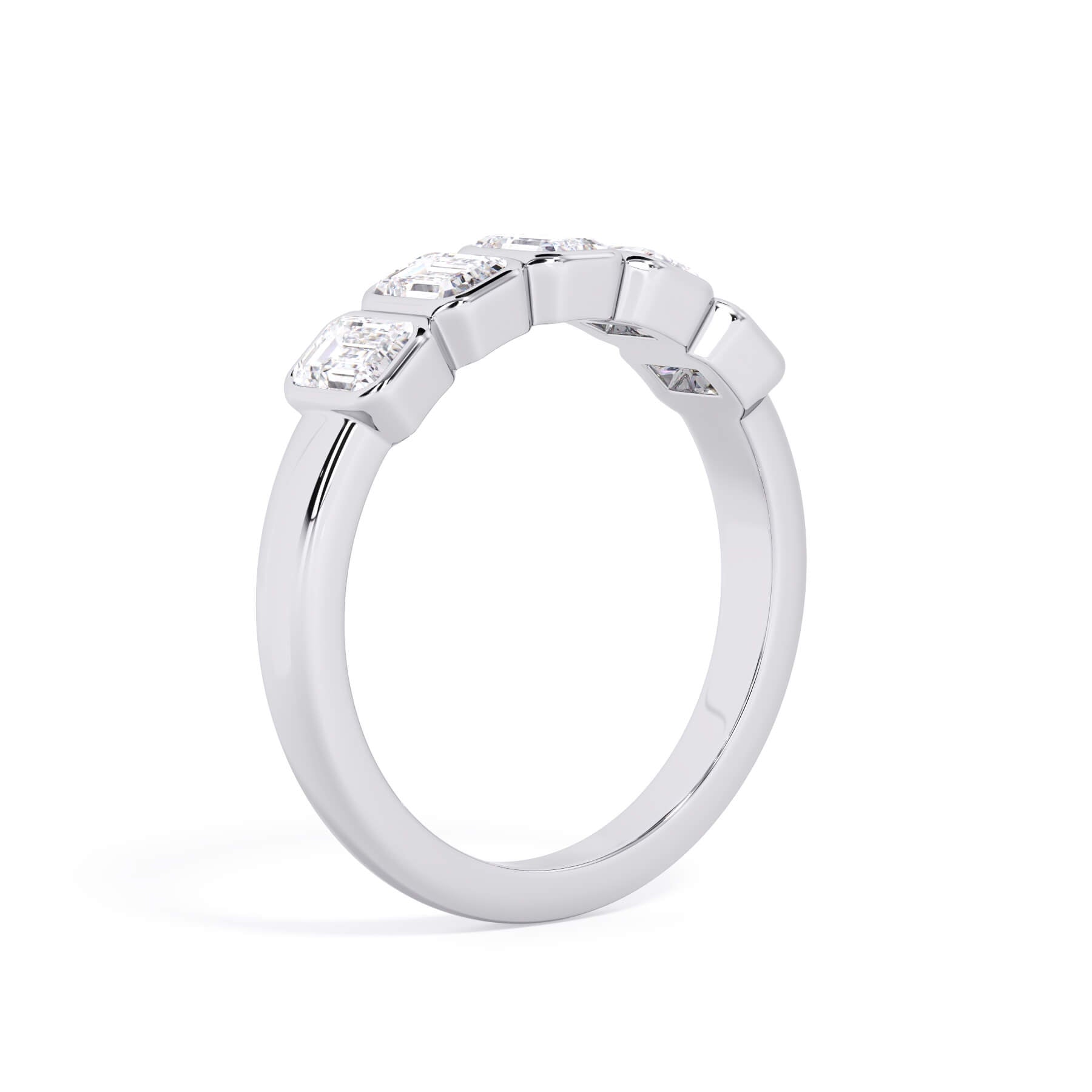 A picture of a five stone diamond wedding ring with emerald cut diamonds that are bezel set in white gold or platinum on a white background with a slightly angled, through the finger view.