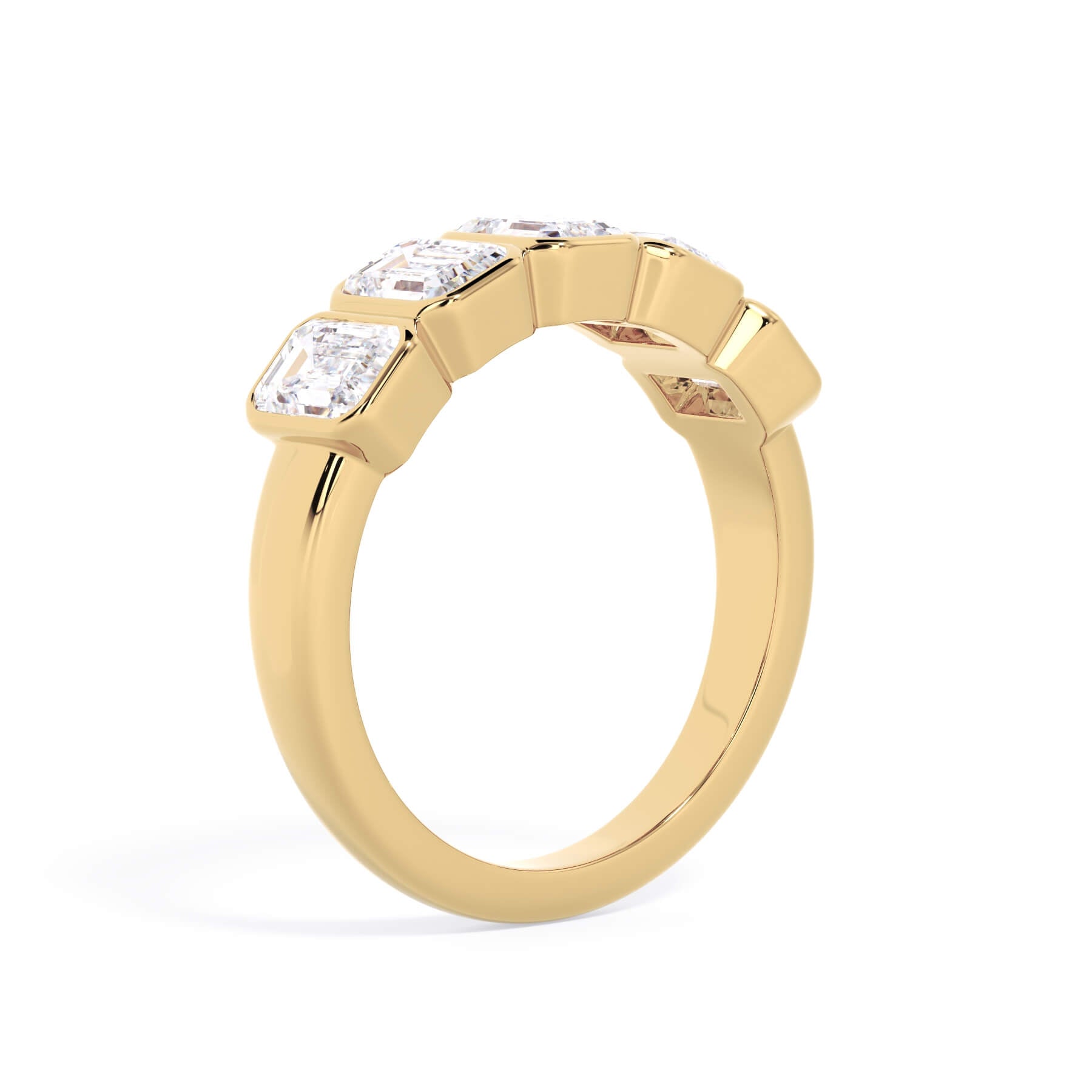 A picture of a five stone diamond wedding ring with emerald cut diamonds that are bezel set in yellow gold on a white background with a slightly angled, through the finger view.