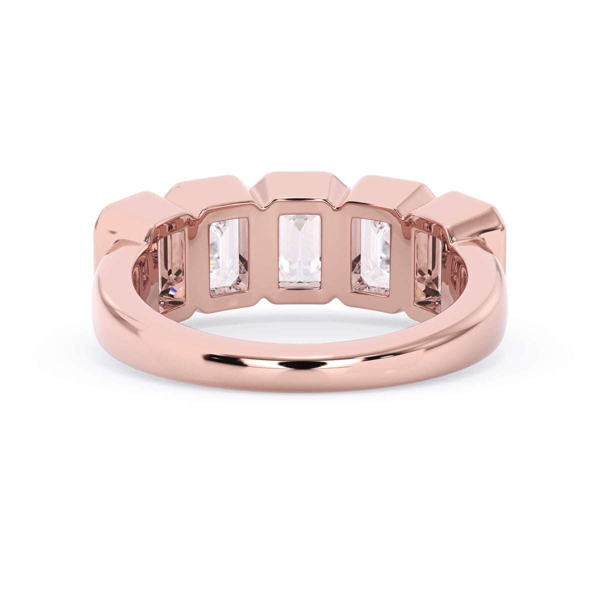 A picture of a five stone diamond wedding ring with emerald cut diamonds that are bezel set in rose gold on a white background with a view of the underside of the ring.