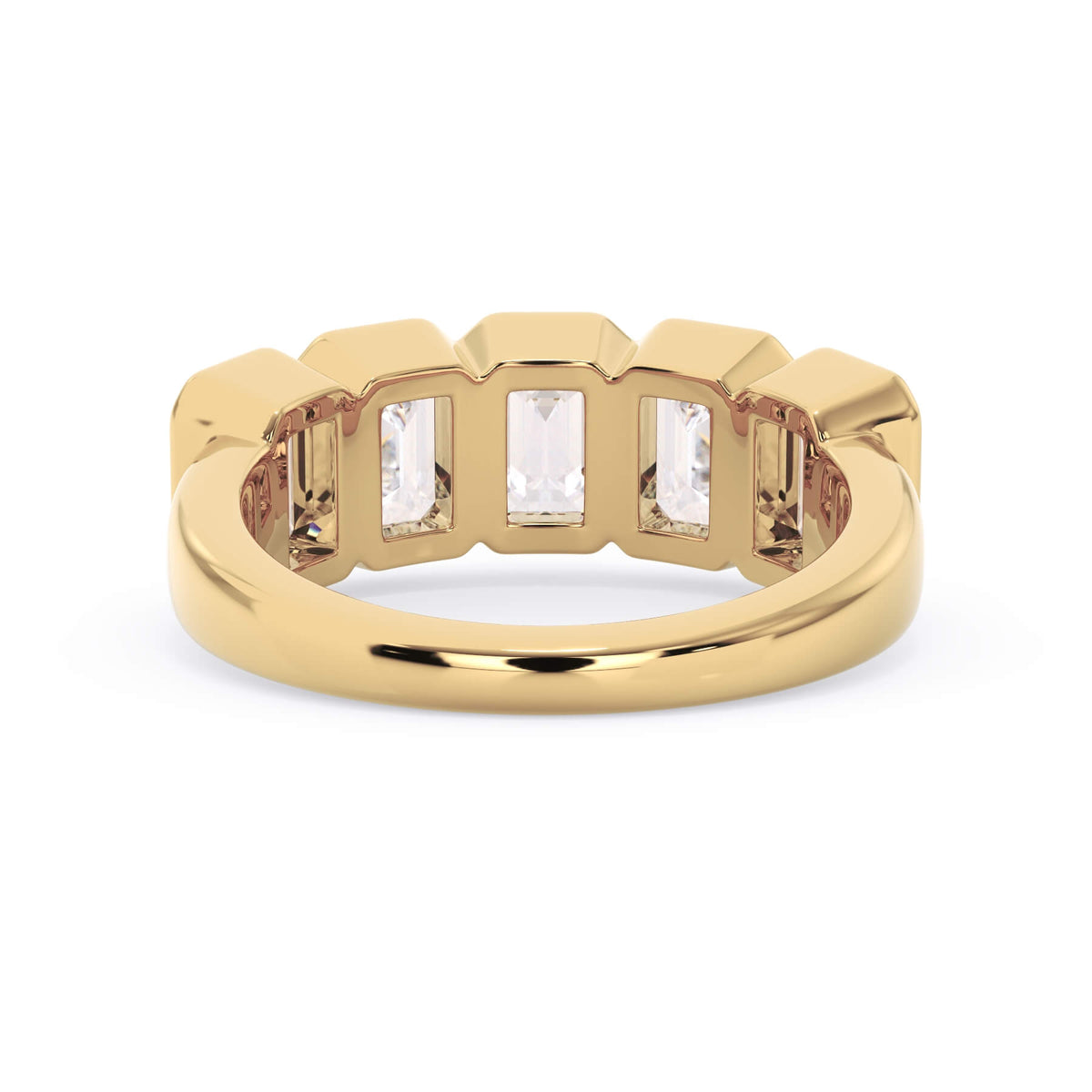A picture of a five stone diamond wedding ring with emerald cut diamonds that are bezel set in yellow gold on a white background with a view of the underside of the ring.