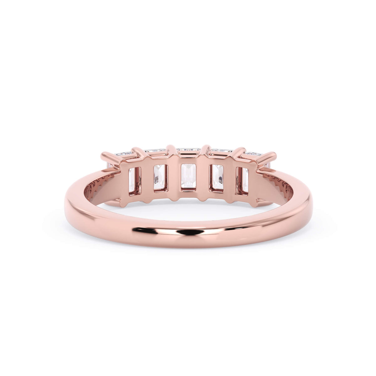 A picture of a five stone diamond wedding ring with emerald cut diamonds that are shared prong set in rose gold on a white background with a view of the underside of the ring.