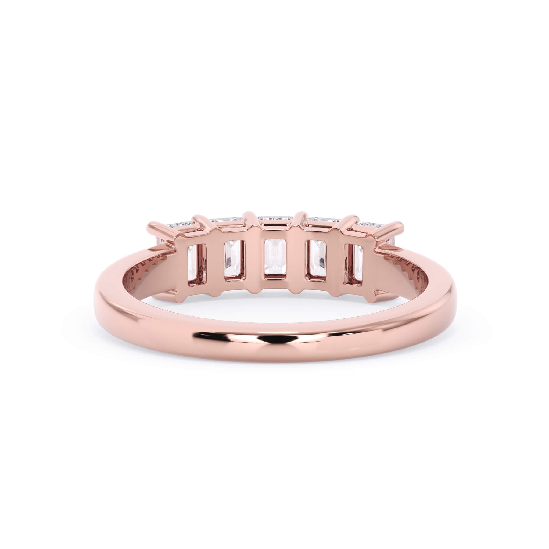 A picture of a five stone diamond wedding ring with emerald cut diamonds that are shared prong set in rose gold on a white background with a view of the underside of the ring.