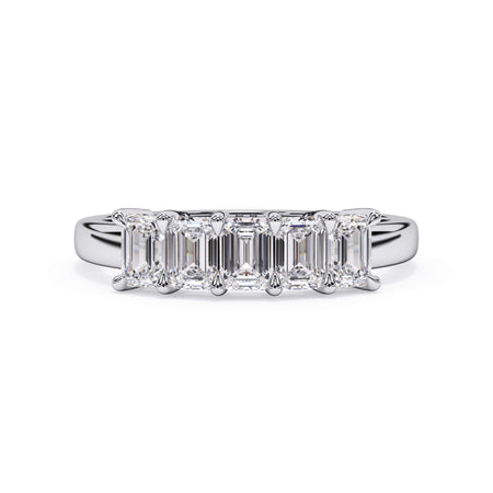 A picture of a five stone diamond wedding ring with emerald cut diamonds that are shared prong set in white gold or platinum on a white background with the ring facing forward, lying down.