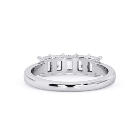 A picture of a five stone diamond wedding ring with emerald cut diamonds that are shared prong set in white gold or platinum on a white background with a view of the underside of the ring.