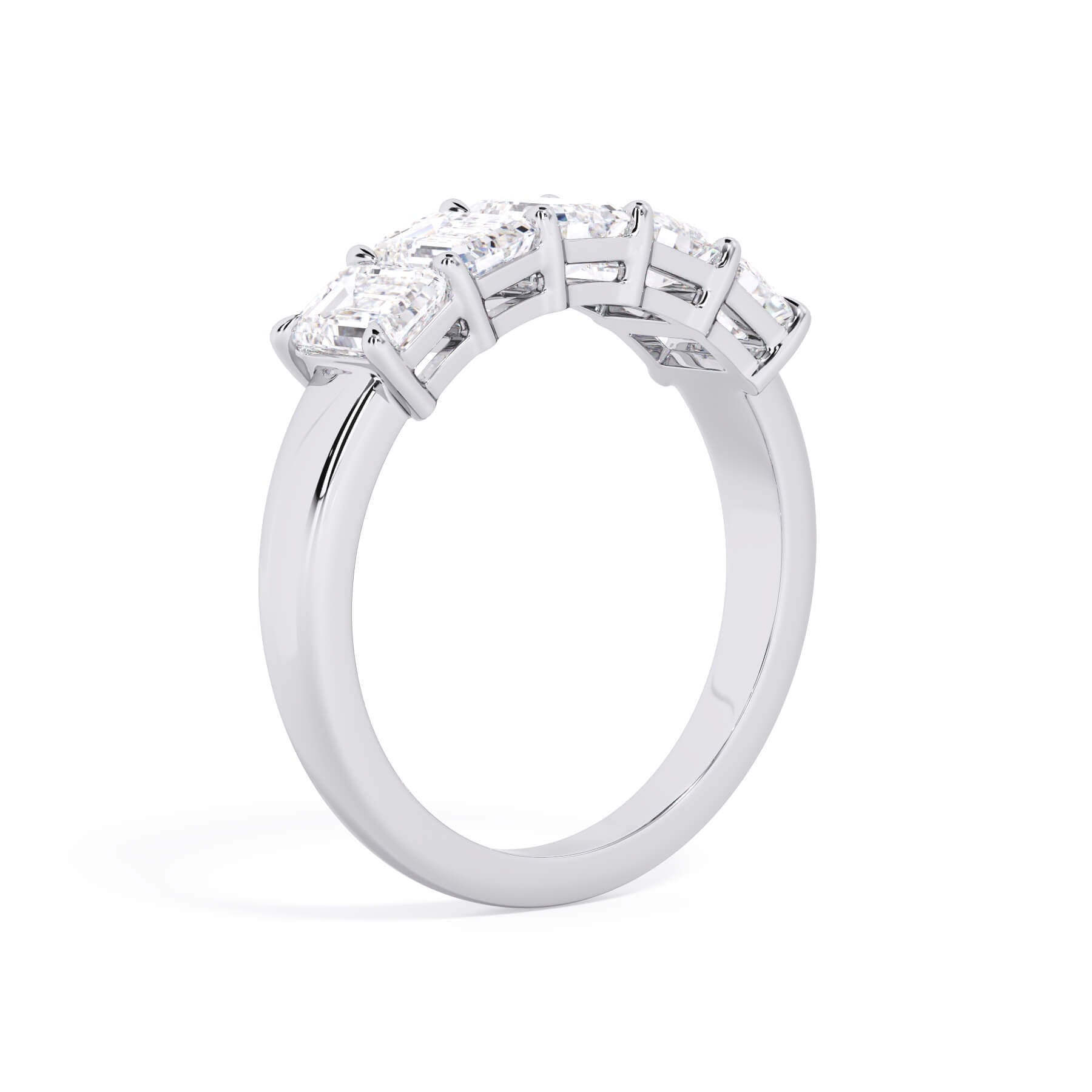 A picture of a five stone diamond wedding ring with emerald cut diamonds that are shared prong set in white gold or platinum on a white background with a slightly angled, through the finger view.