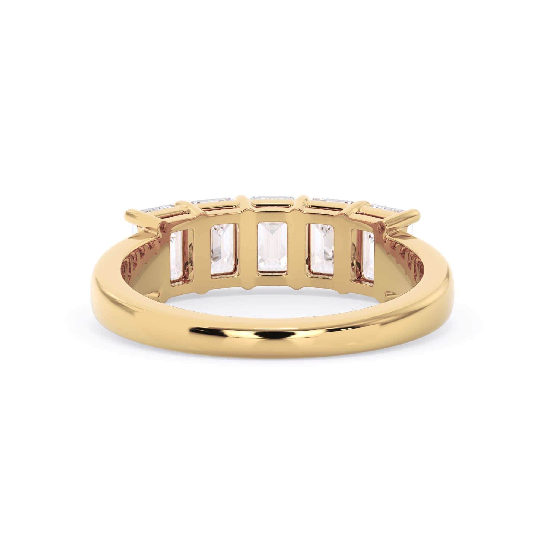 A picture of a five stone diamond wedding ring with emerald cut diamonds that are shared prong set in yellow gold on a white background with a view of the underside of the ring.