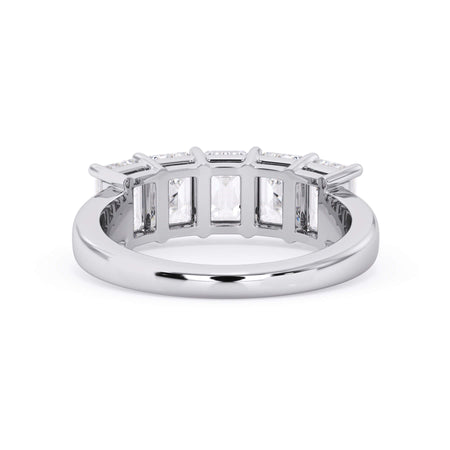 A picture of a five stone diamond wedding ring with emerald cut diamonds that are shared prong set in white gold or platinum on a white background with a view of the underside of the ring.