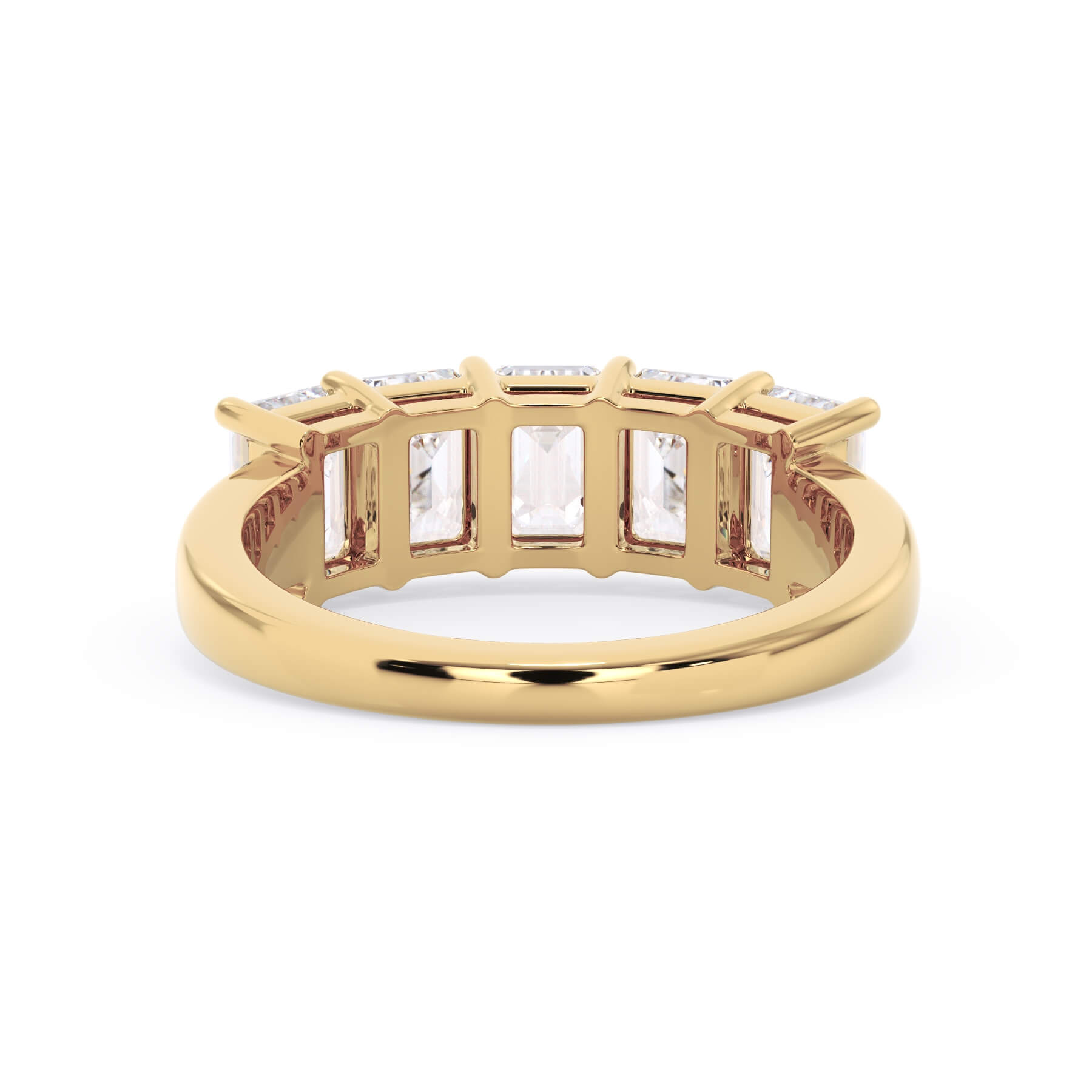 A picture of a five stone diamond wedding ring with emerald cut diamonds that are shared prong set in yellow gold on a white background with a view of the underside of the ring.