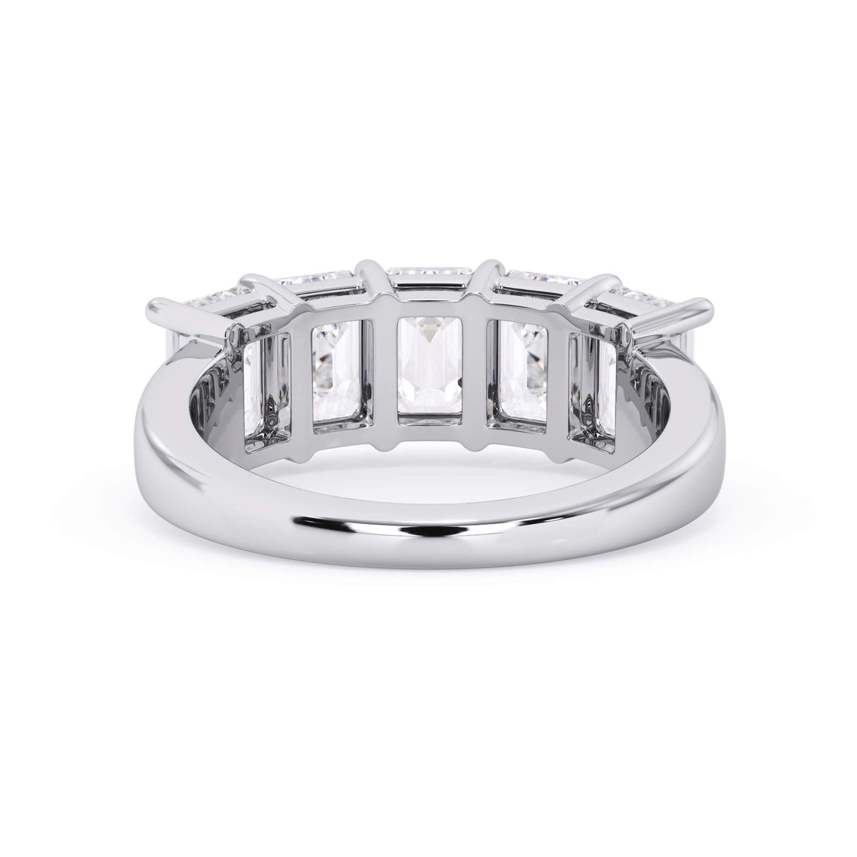 A picture of a five stone diamond wedding ring with emerald cut diamonds that are shared prong set in white gold or platinum on a white background with a view of the underside of the ring.