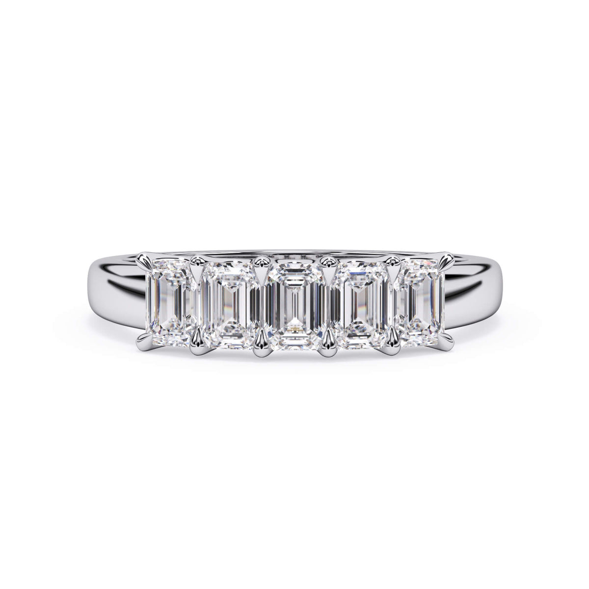 A picture of a five stone diamond wedding ring with emerald cut diamonds that are u prong set in white gold or platinum on a white background with the ring facing forward, lying down.