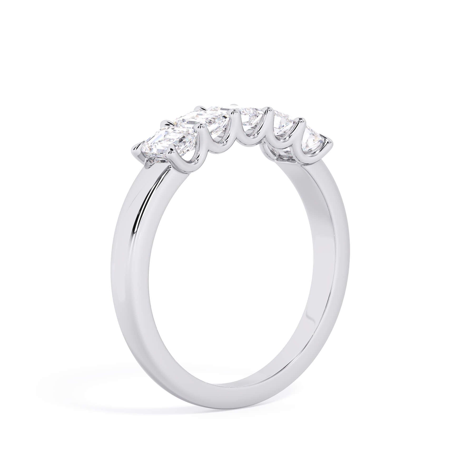 A picture of a five stone diamond wedding ring with emerald cut diamonds that are u prong set in white gold or platinum on a white background with a slightly angled, through the finger view.