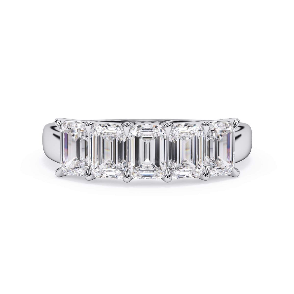 A picture of a five stone diamond wedding ring with emerald cut diamonds that are u prong set in white gold or platinum on a white background with the ring facing forward, lying down.