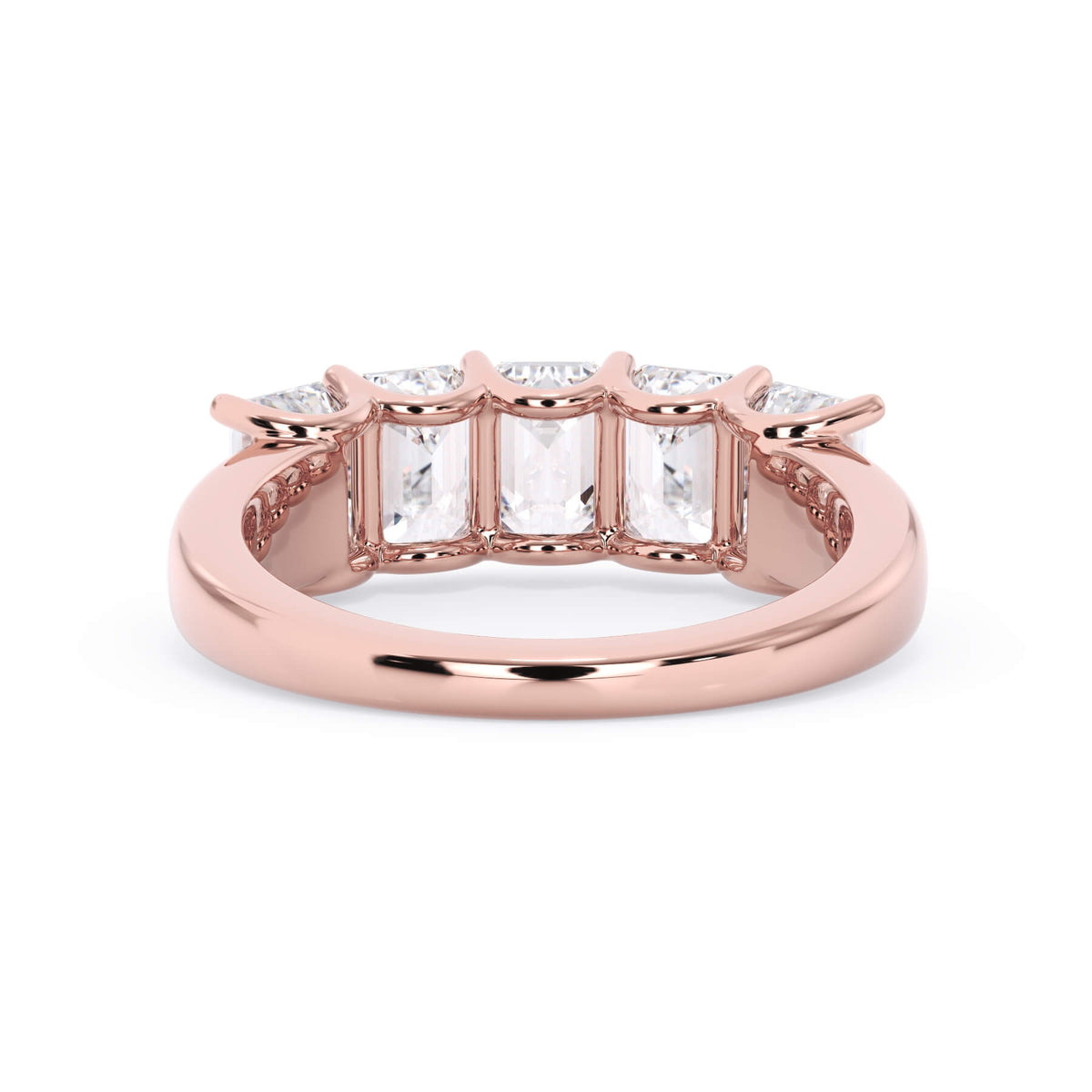 A picture of a five stone diamond wedding ring with emerald cut diamonds that are u prong set in rose gold on a white background with a view of the underside of the ring.