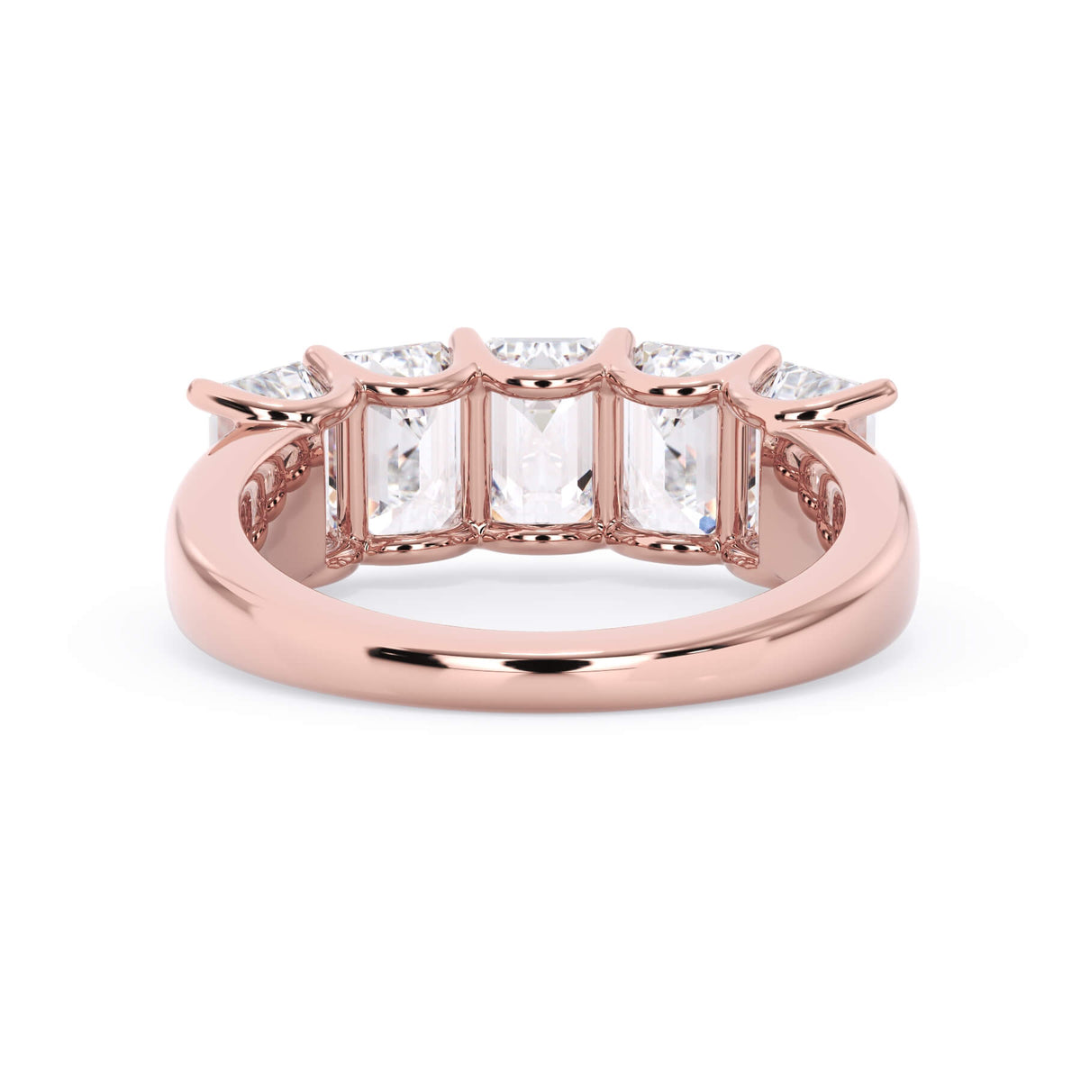 A picture of a five stone diamond wedding ring with emerald cut diamonds that are u prong set in rose gold on a white background with a view of the underside of the ring.
