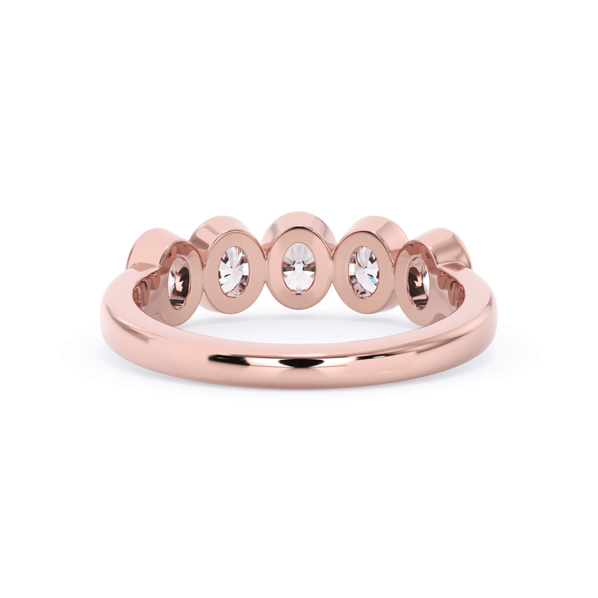 A picture of a five stone diamond wedding ring with oval shape diamonds that are bezel set in rose gold on a white background with a view of the underside of the ring.
