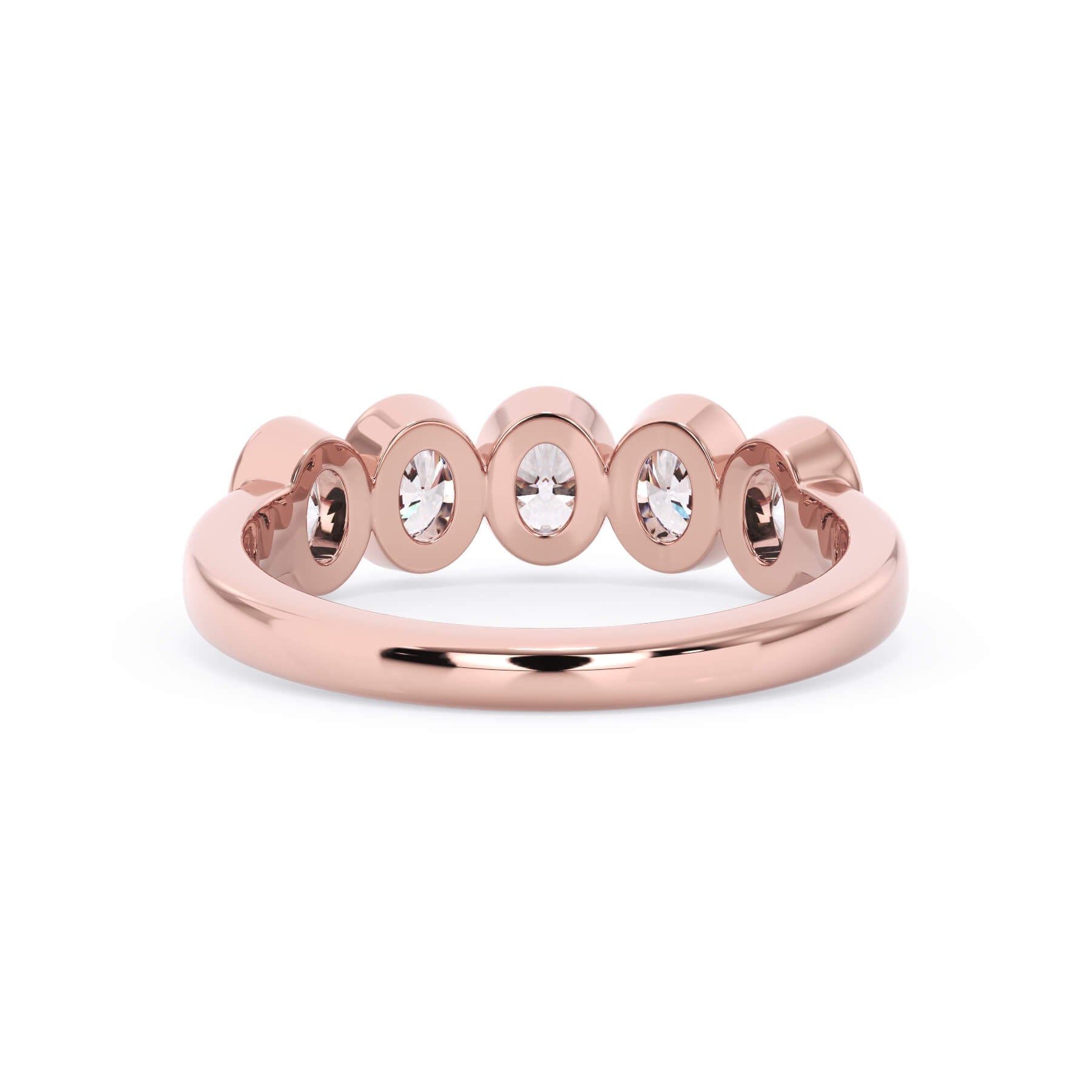 A picture of a five stone diamond wedding ring with oval shape diamonds that are bezel set in rose gold on a white background with a view of the underside of the ring.