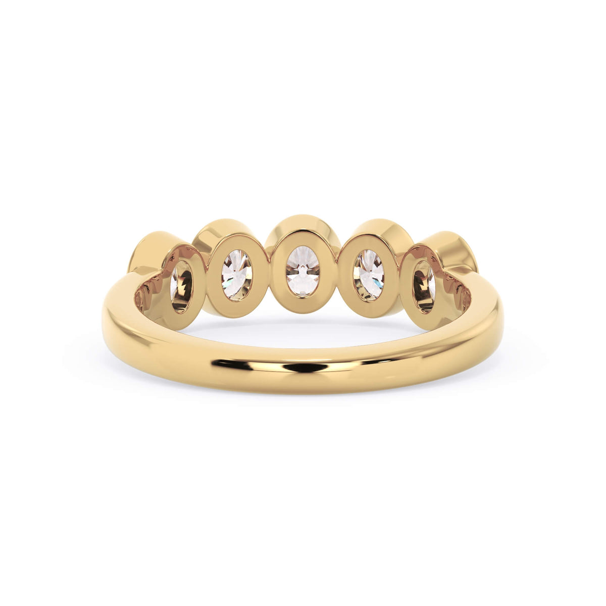 A picture of a five stone diamond wedding ring with oval shape diamonds that are bezel set in yellow gold on a white background with a view of the underside of the ring.