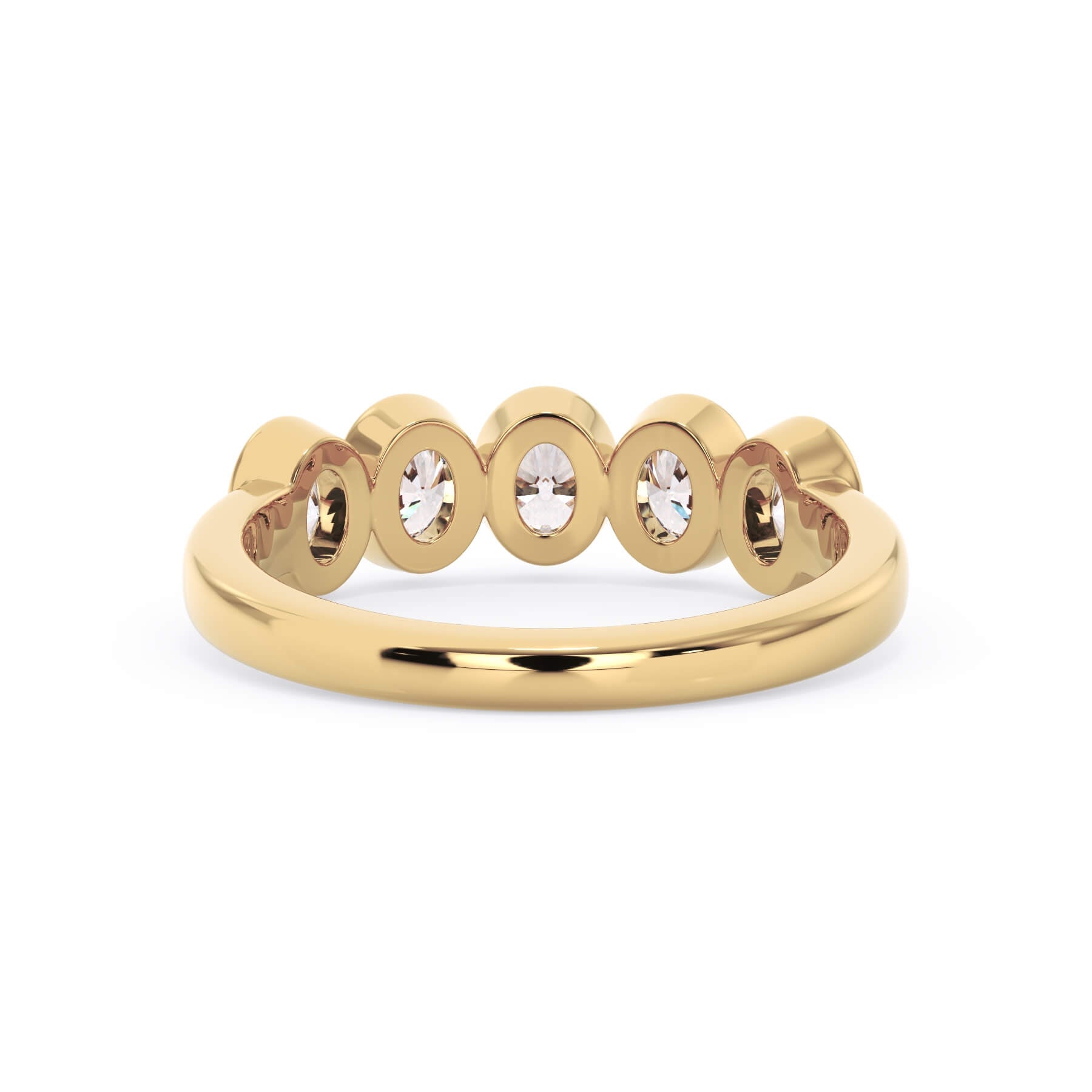 A picture of a five stone diamond wedding ring with oval shape diamonds that are bezel set in yellow gold on a white background with a view of the underside of the ring.