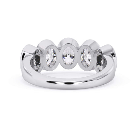 A picture of a five stone diamond wedding ring with oval shape diamonds that are bezel set in white gold or platinum on a white background with a view of the underside of the ring.