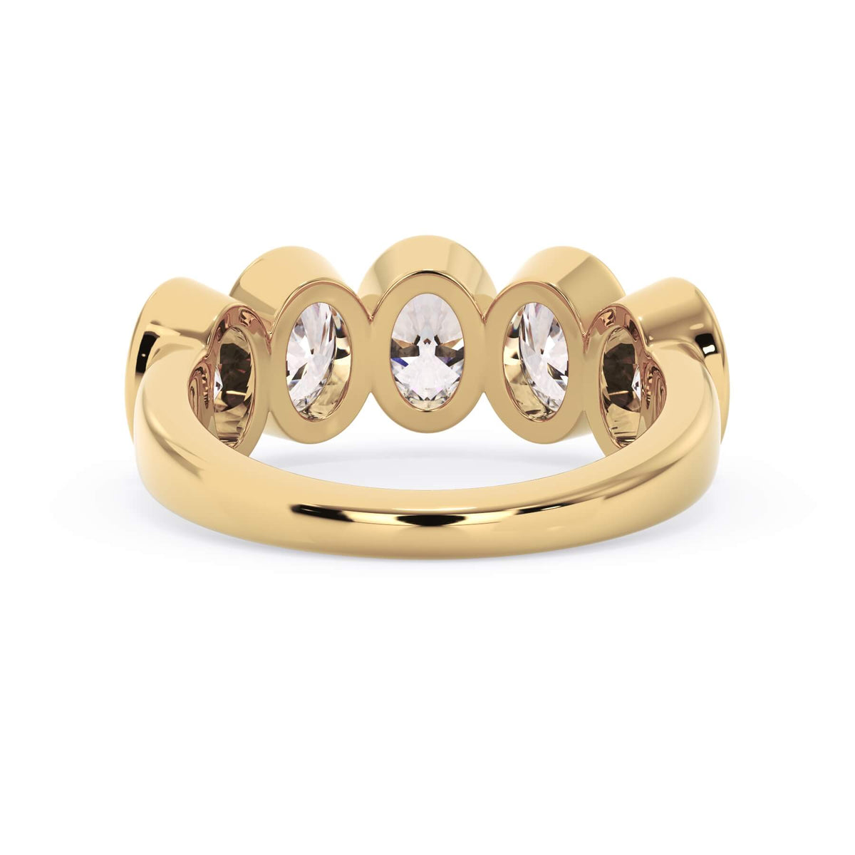 A picture of a five stone diamond wedding ring with oval shape diamonds that are bezel set in yellow gold on a white background with a view of the underside of the ring.