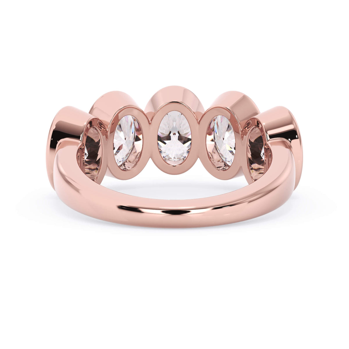 A picture of a five stone diamond wedding ring with oval shape diamonds that are bezel set in rose gold on a white background with a view of the underside of the ring.