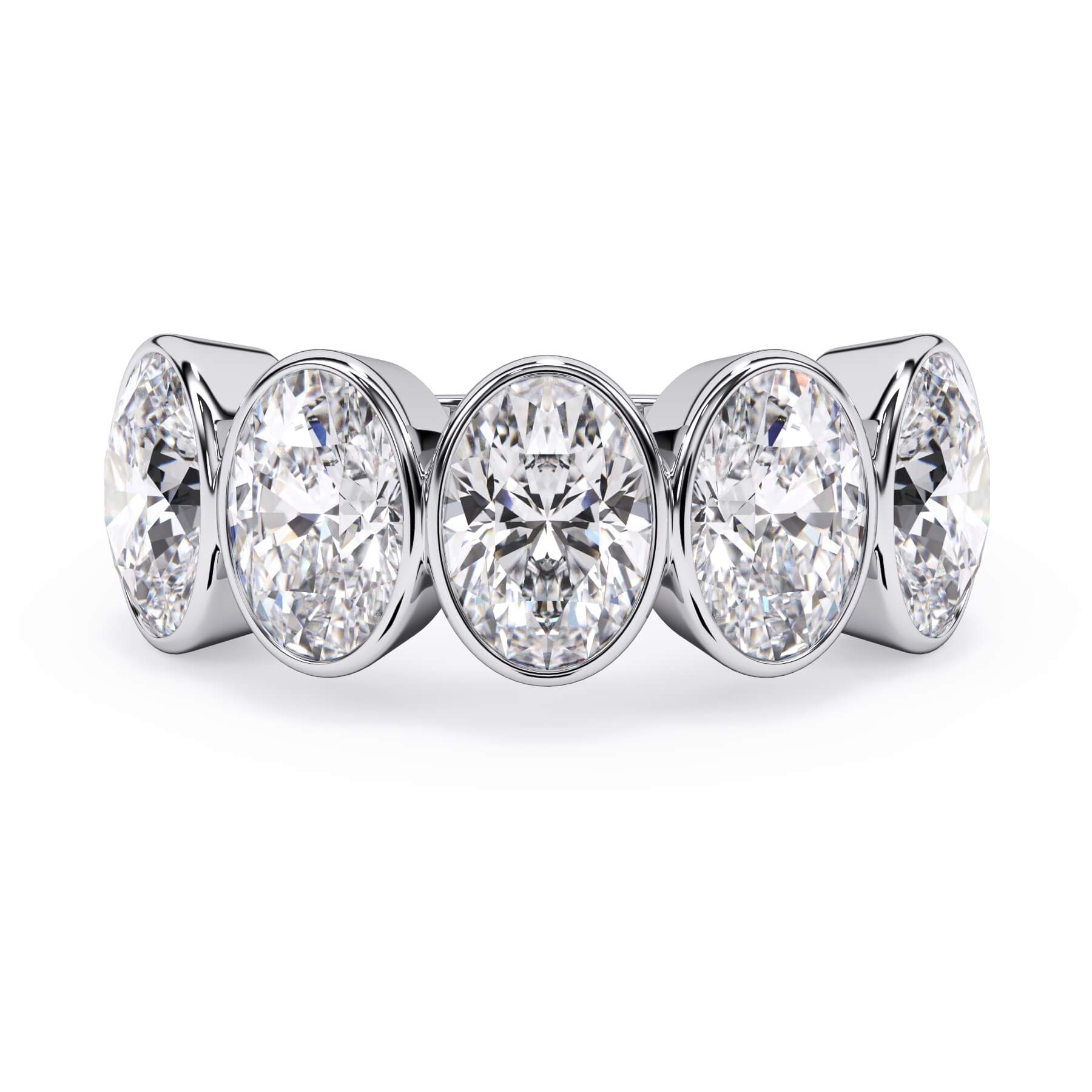A picture of a five stone diamond wedding ring with oval shape diamonds that are bezel set in white gold or platinum on a white background with the ring facing forward, lying down.